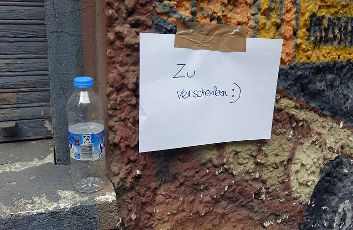 A deposit bottle and a note saying ‘Up for grabs’
