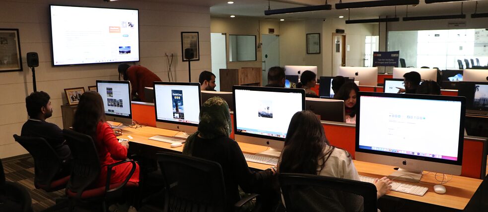 A group of workshop participants working on their PCs
