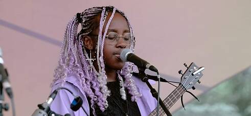 Angelina Akawa during a music performance