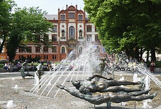 University square with vitality fountain and Rostock University building