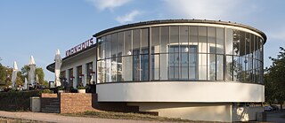 Over 300 buildings in the Bauhaus style are still standing in Dessau. They include the Kornhaus, a restaurant designed by the architect Carl Fieger.