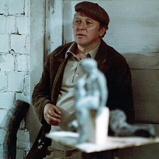 A group of contruction workers wearing helmets and another man sitting an talking