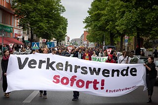 Demonstrators call for a transport revolution with a large banner reading ‘Transport revolution now!’