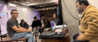 Technical team in Delhi communicating with the directors regarding technical requirements and live transmission setups.