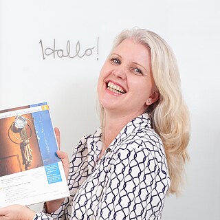 Portrait of a teacher in front of a whiteboard
