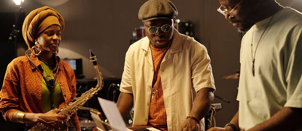 Musicians performing in studio with instruments