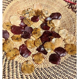 Assorted handmade moringa‑ and sorghum‑based snacks in earthy tones displayed on a woven mat for a holistic food workshop.