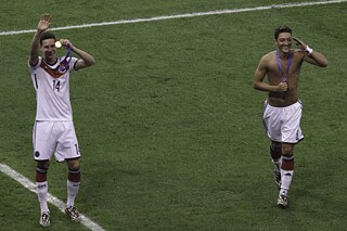 Mesut Özil celebrating after winning the World Cup in 2014.