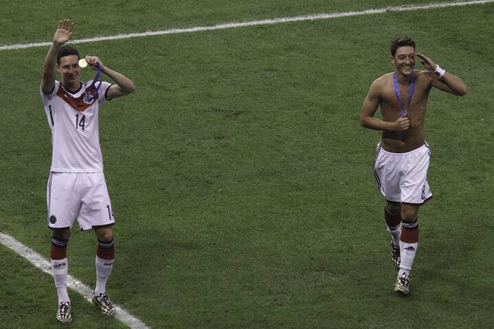 Mesut Özil celebrating after winning the World Cup in 2014.