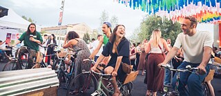 Participants pedaling on stationary bikes