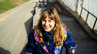 A young woman smiling into the camera
