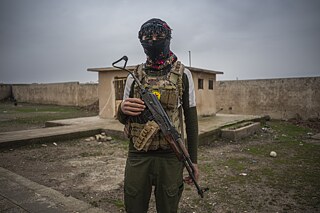 Kurdští vojáci se vracejí z fronty po střetech se syrskou armádou.