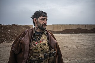 Kurdští vojáci se vracejí z fronty po střetech se syrskou armádou.