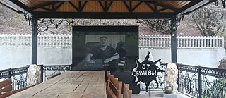 A man on a screen, open air, nobody's there