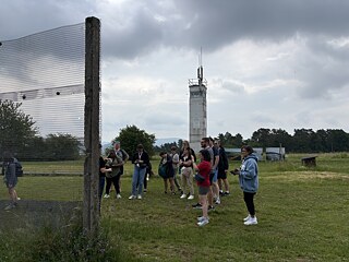 The TOP 1 2026 group looks around the former East German border fortifications at Point Alpha.