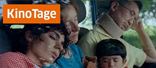 Promotional banner with the text “KinoTage” in a large orange box, over a scene of four passengers resting with their eyes closed inside a vehicle during daylight.