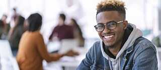 A man smiling on camera
