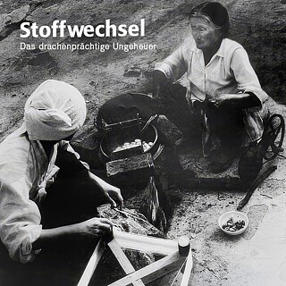 Black-and-white image showing two people working with silk production around a steaming pot, featuring the film title Stoffwechsel