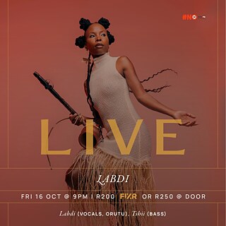 Labdi performing with a traditional string instrument for the MobiArts Tour at Athletic Club & Social in Cape Town.