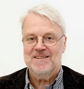 a protrait of a white-haired man