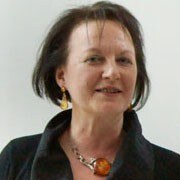 portrait of a woman with dark hair and a dark shirt