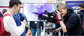 A cameraman filming