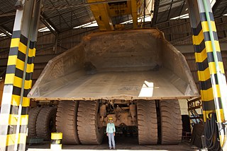 Hartware MedienKunstVerein „World of Matter”, 2014, Woman electric engineer operator of big machines, at garage of iron mine of multinational company in Minas Gerais, Brasil, 