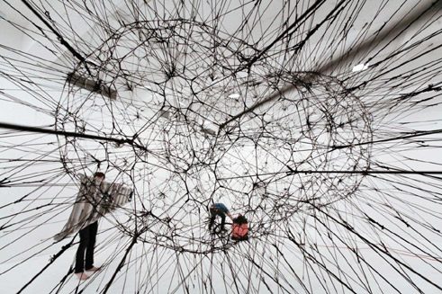 Galaxies forming along Filaments, like Droplets along the Strands of a Spider´s Web