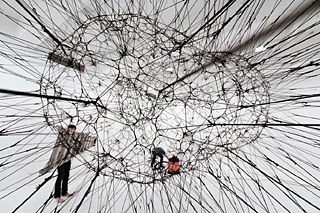 Galaxies forming along Filaments, like Droplets along the Strands of a Spider´s Web