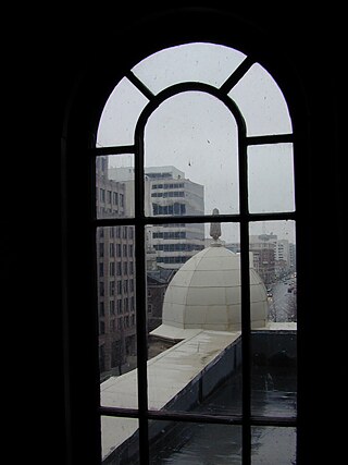 Inside Franklin School: View looking north on 13th Street NW. View northwest towards Alexander Graham Bell's former laboratory at 1325 L St, NW. On June 3, 1880, Bell sent a message from the school to a window in the laboratory building. (2000)