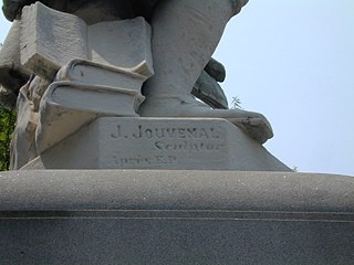 The base of the statue of Benjamin Franklin contains the name of the German-born sculptor, Jacques Jouvenal. (2000)