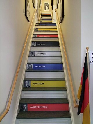 Hockemeyer Hall entryway. Now open as the German-American Heritage Museum, the staircase features the names of famous Americans with German-American ancestry. 2010.