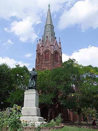 The statue of Martin Luther by Ernst Rietschel stands prominently in front of Luther Place Memorial Church, 2000.