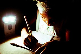 Schreibendes Kind in Haiti