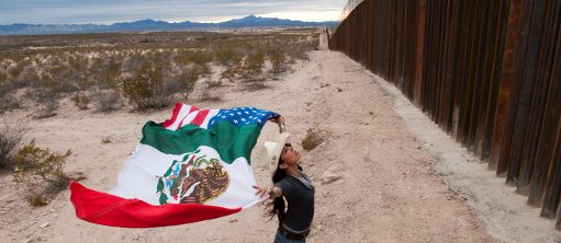 American photographer, peace activist and educator Raechel Running at the border fence near Agua Prieta, Mexico, where she continuously works with a local community. (c) Stefan Falke