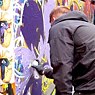 A street artist in Melbourne's famous Hosier Lane 