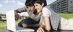  Young couple looking at laptop 