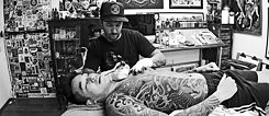 Rhys Gordon tattooing a client