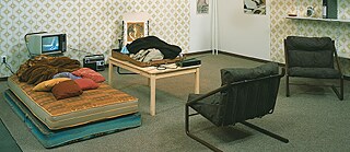 Part-reconstruction of a conspirative flat of the Rote Armee Fraktion (RAF, Red Army Faction), based on photographs by the Bundeskriminalamt (BKA, Federal Office of Criminal Investigation), archival material: conspirative RAF flat 1975-1985 BKA Wiesbaden, 240 x 500 x 500 cm