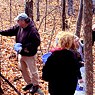 Volunteers painting one of several 1/3 mile Blued Trees measures, in Rensselaer County, New York.