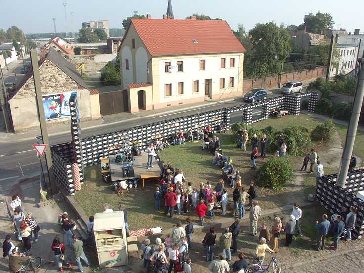 The residents helped building the library made of drinking crates.