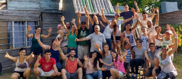 Course participants cut plastic bottles to be repurposed as part of a solar water heater.