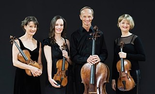 NEW ZEALAND STRING QUARTET - Portrait. The musicians are shown with their instruments. © © NZSQ NEW ZEALAND STRING QUARTET - Portrait
