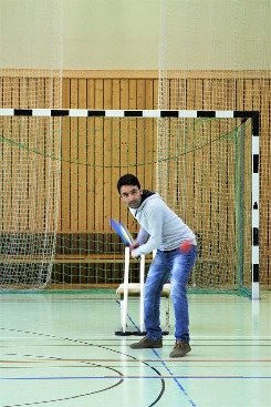 Cricket training on an indoor soccer pitch.