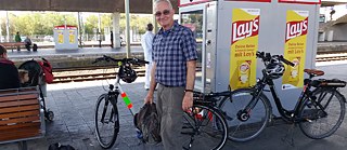 Dave with bike at German rail station  © © Dave Lowe Dave with bike at German rail station 