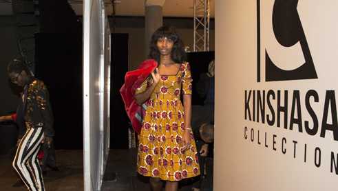A model is preparing for the show that was organized by the South African fashion activist Goitseone Montsho.