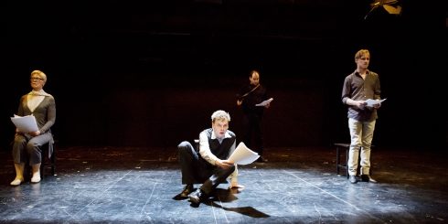 The bus is not coming: Three people and doll grapple with communication issues at a bus stop. Actors from left to right: Norman Hacker, Paul Wolff-Plotegg, Christian Erdt.