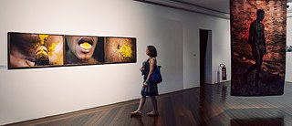 Exhibition space at the Centro Municipal de Arte Hélio Oiticica with works by Ayrson Heráclito (left) and Ana Leticia Barreto (right).
