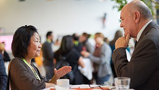 Conference participants in a discussion.