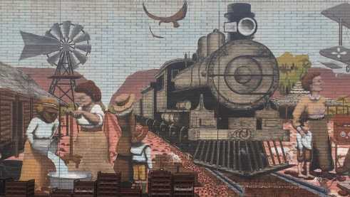 A graffiti shows the history of Australian settlers.